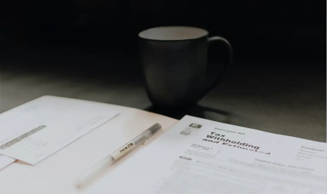 Photo of tax forms and coffee mug