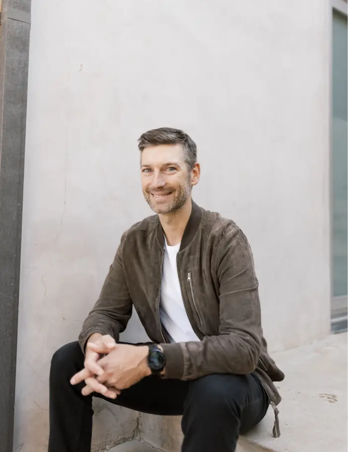 Photo of Ryan sitting on steps